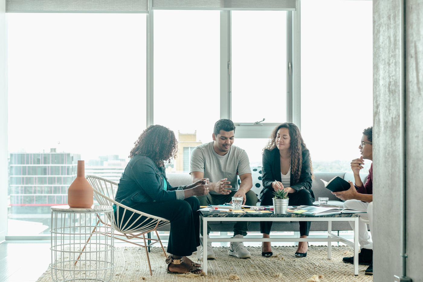 Team brainstorm meeting in modern office